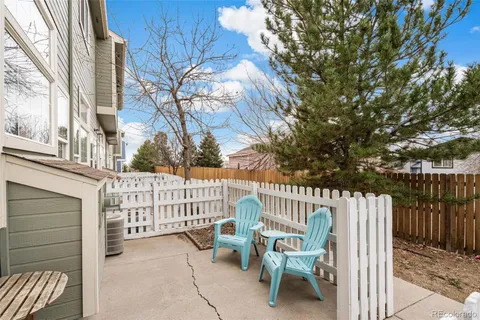 a view of a chair and table in the balcony