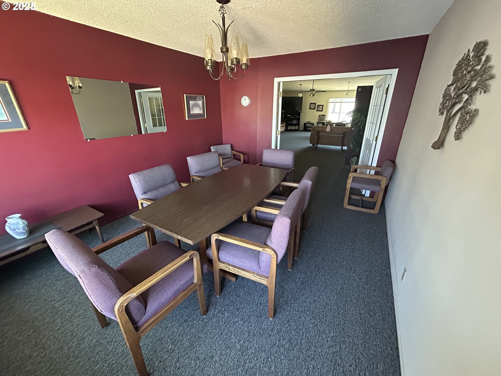 950 Evergreen Road, Unit 229 Woodburn, OR 97071 - Photo 29 of 33 a living room with furniture and a chandelier