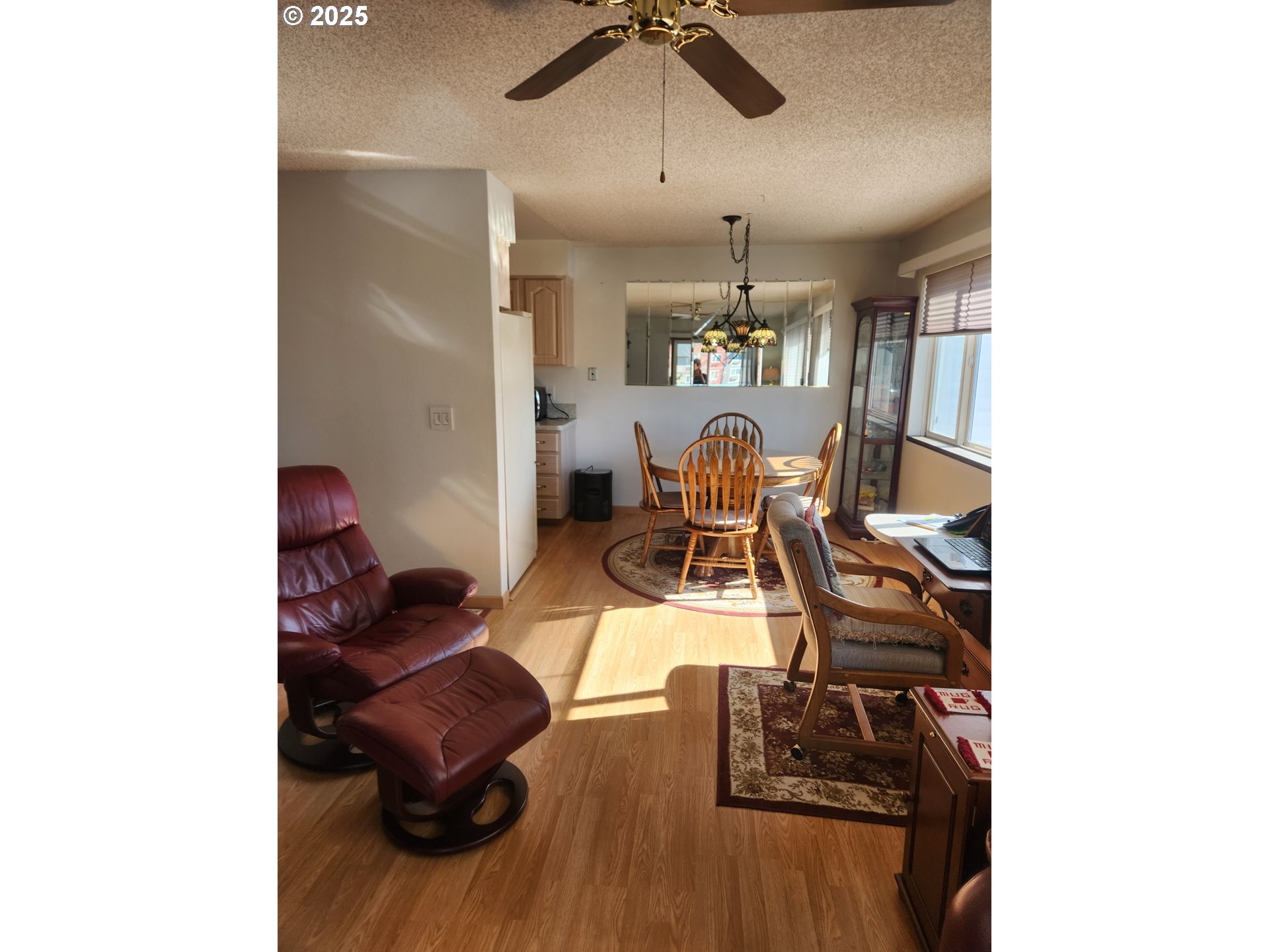 950 Evergreen Road, Unit 229 Woodburn, OR 97071 - Photo 8 of 33 a living room with furniture and a wooden floor