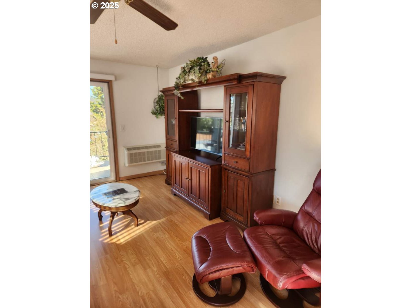 950 Evergreen Road, Unit 229 Woodburn, OR 97071 - Photo 9 of 33 a living room with furniture and a flat screen tv