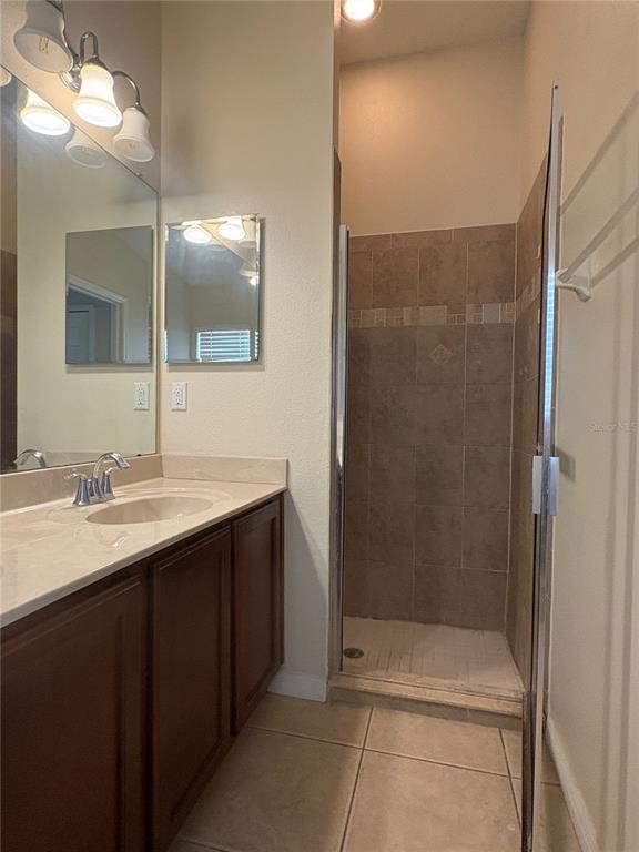 3878 Prescott Loop Lakeland, FL 33810 - Photo 8 of 12 a bathroom with a sink and mirror
