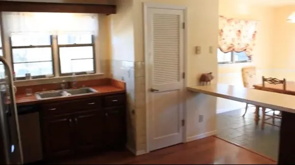 a view of a dining room with furniture window and outside view