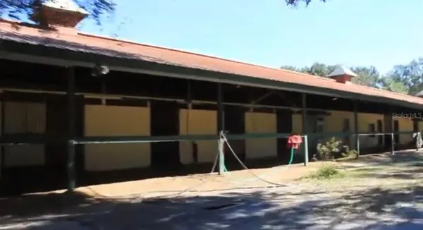 a view of a backyard of the house