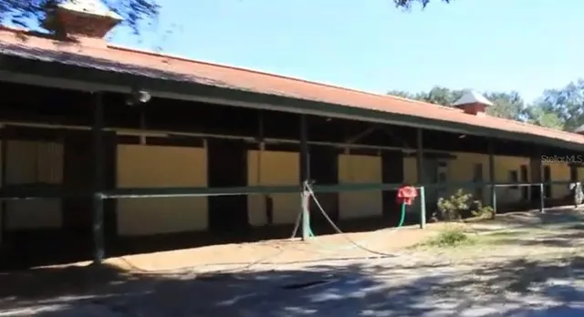 a view of a backyard of the house