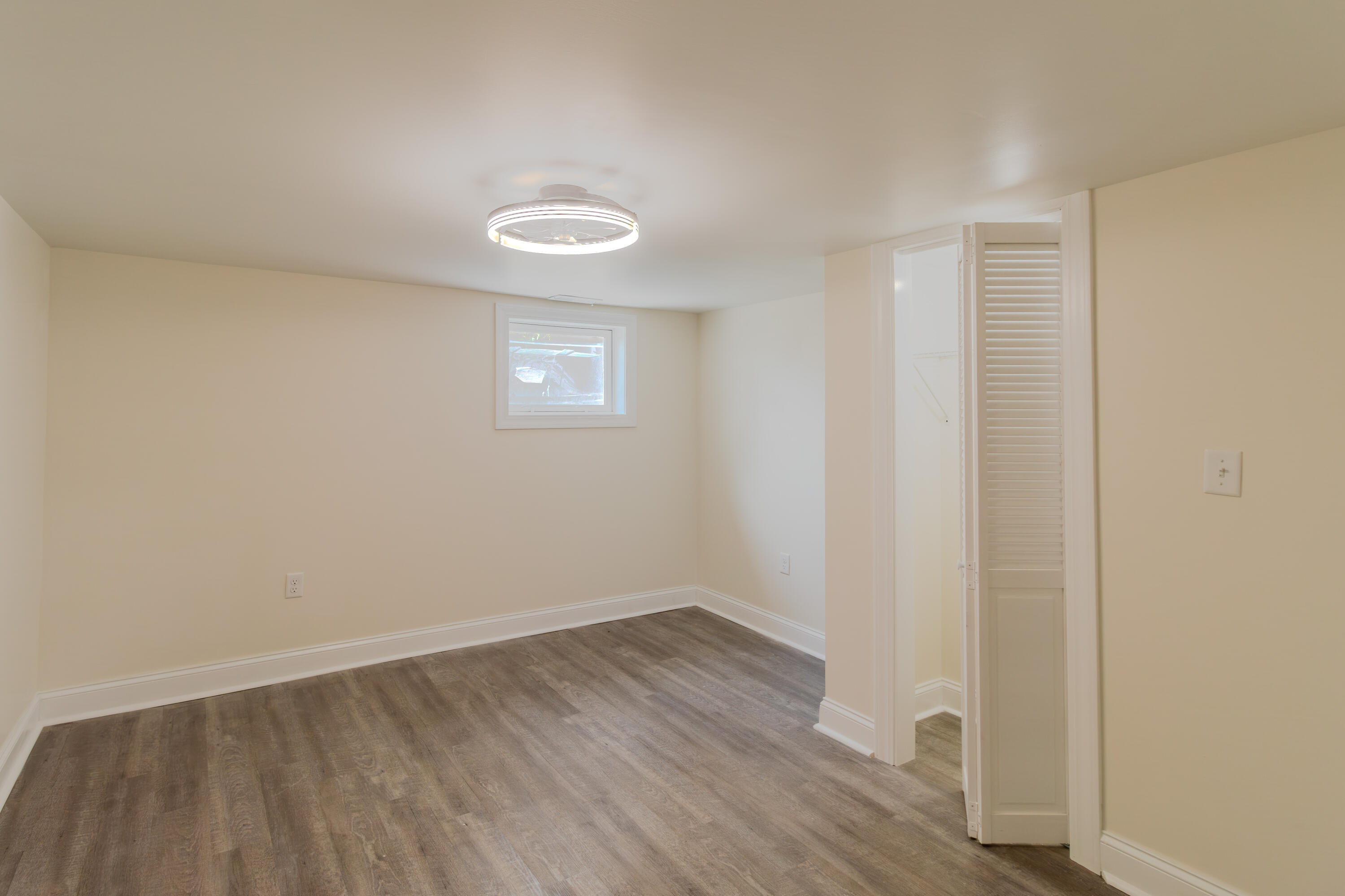3678 Jackson Street Gary, IN 46408 - Photo 23 of 27 a view of a room with wooden floor and white walls
