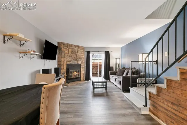 a living room with fireplace furniture and a flat screen tv