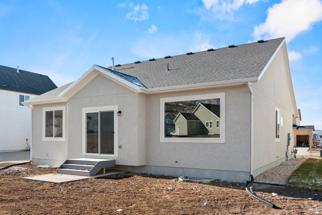 2823 North 710 West, Unit 16 Logan, UT 84321 - Photo 3 of 22 Rear view of property with a shingled roof, stucco siding, and entry steps