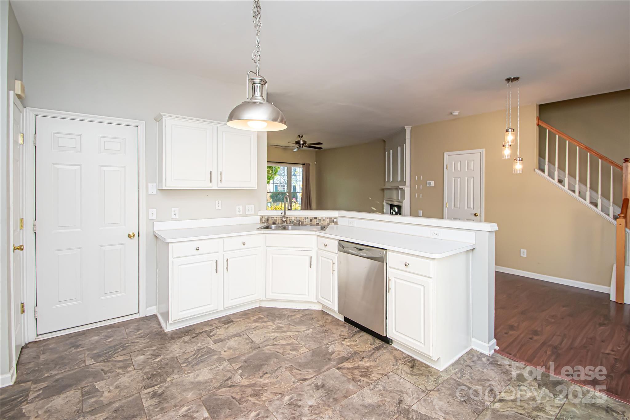 2121 Kaybird Lane Charlotte, NC 28270 - Photo 13 of 39 a kitchen with a sink stove and cabinets