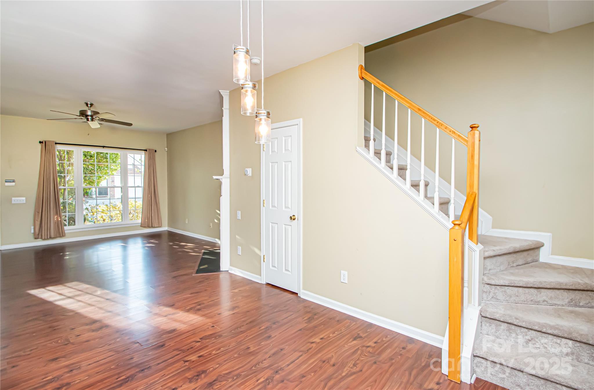 2121 Kaybird Lane Charlotte, NC 28270 - Photo 17 of 39 a view of an entryway with wooden floor and door