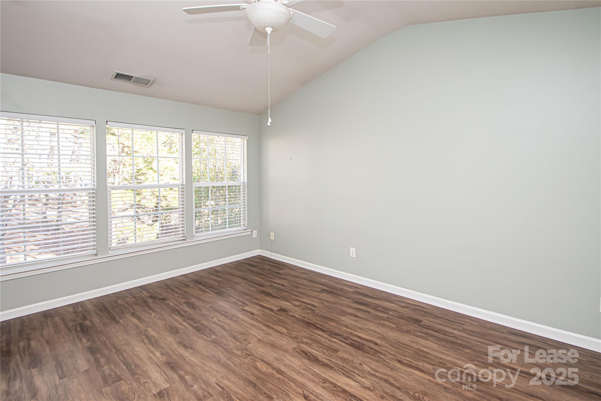 2121 Kaybird Lane Charlotte, NC 28270 - Photo 18 of 39 an empty room with wooden floor and windows