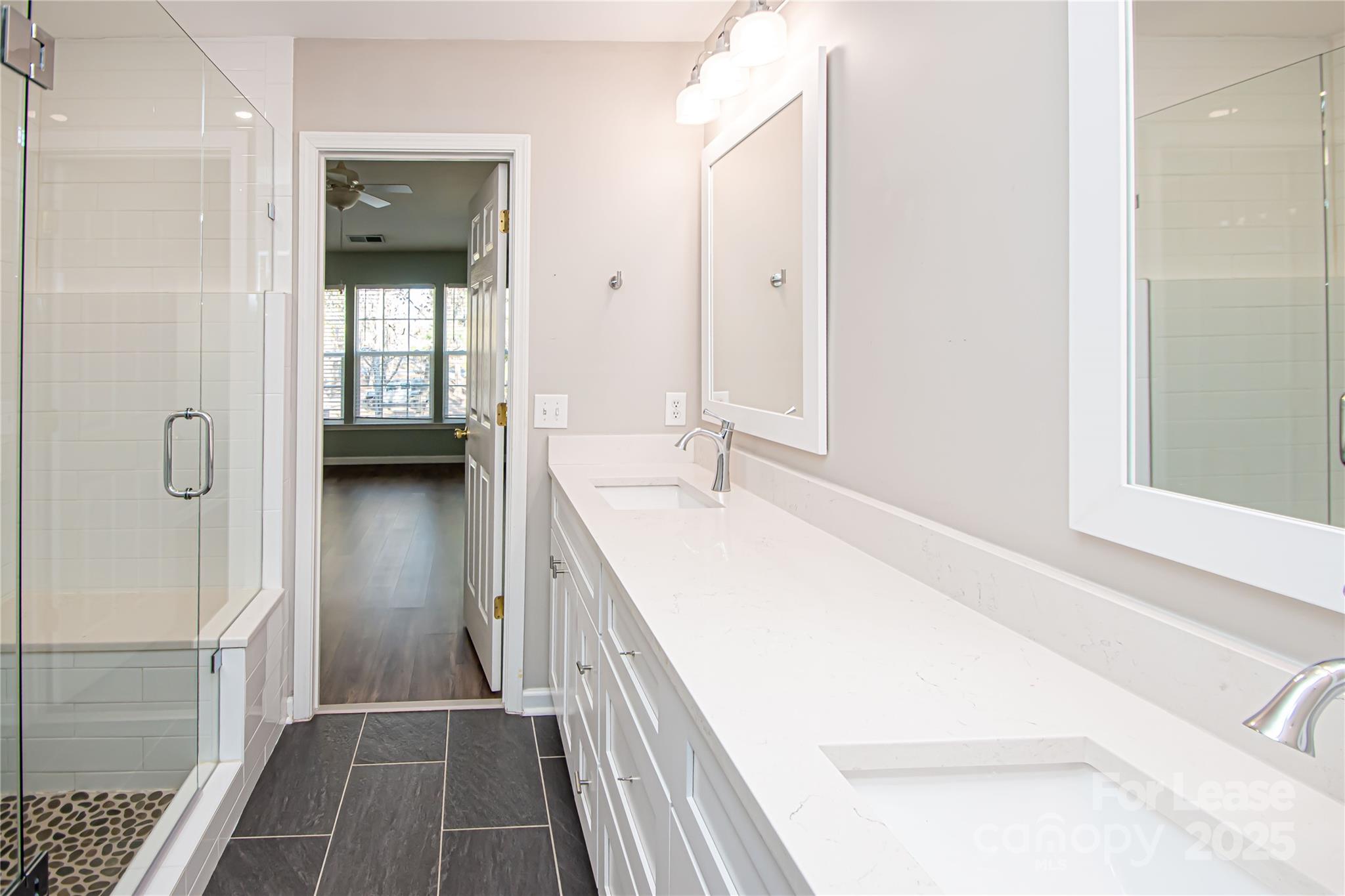2121 Kaybird Lane Charlotte, NC 28270 - Photo 22 of 39 a en suite bathroom with a sink and a mirror