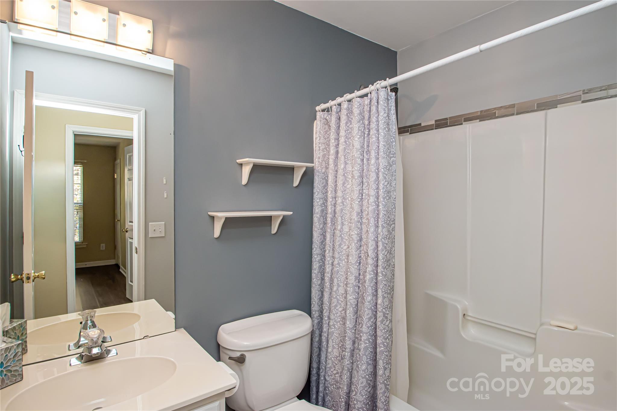 2121 Kaybird Lane Charlotte, NC 28270 - Photo 29 of 39 a bathroom with a sink a toilet and shower