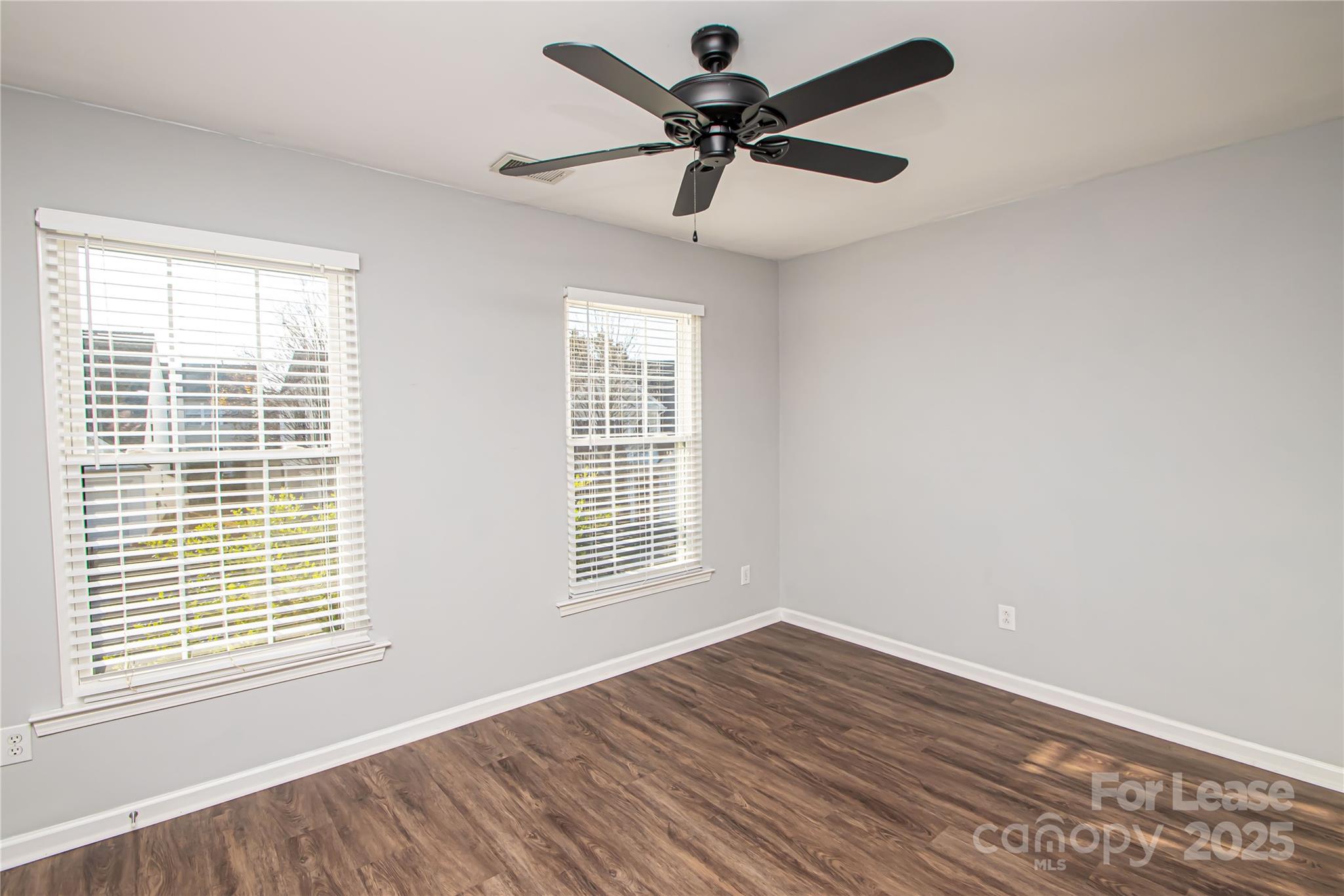 2121 Kaybird Lane Charlotte, NC 28270 - Photo 31 of 39 a view of empty room with wooden floor and fan