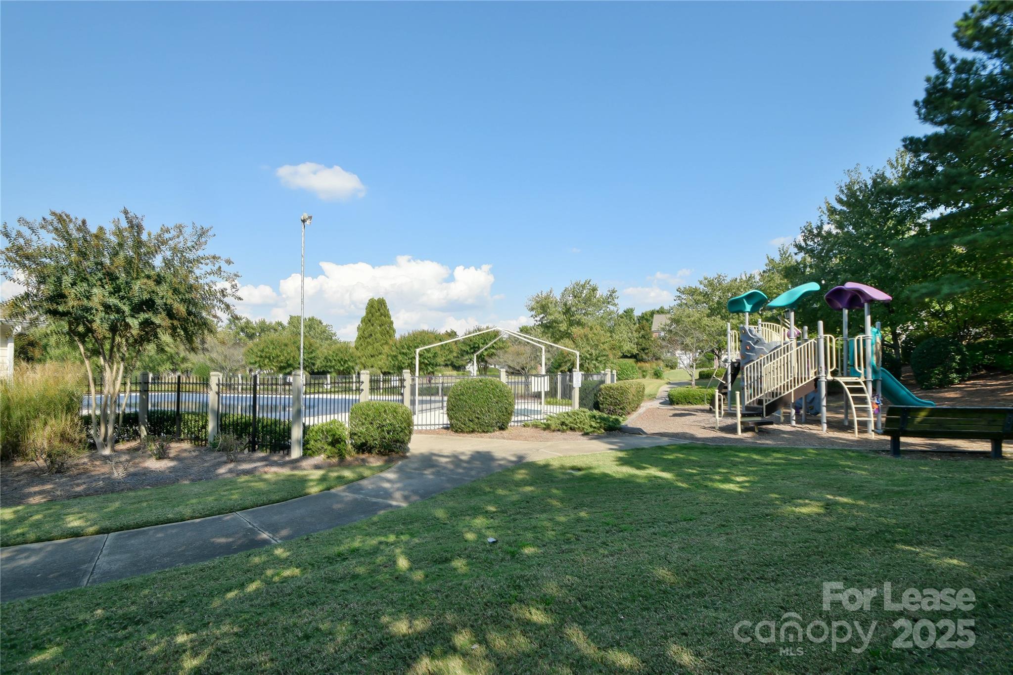2121 Kaybird Lane Charlotte, NC 28270 - Photo 38 of 39 a view of a park with swings and a slide