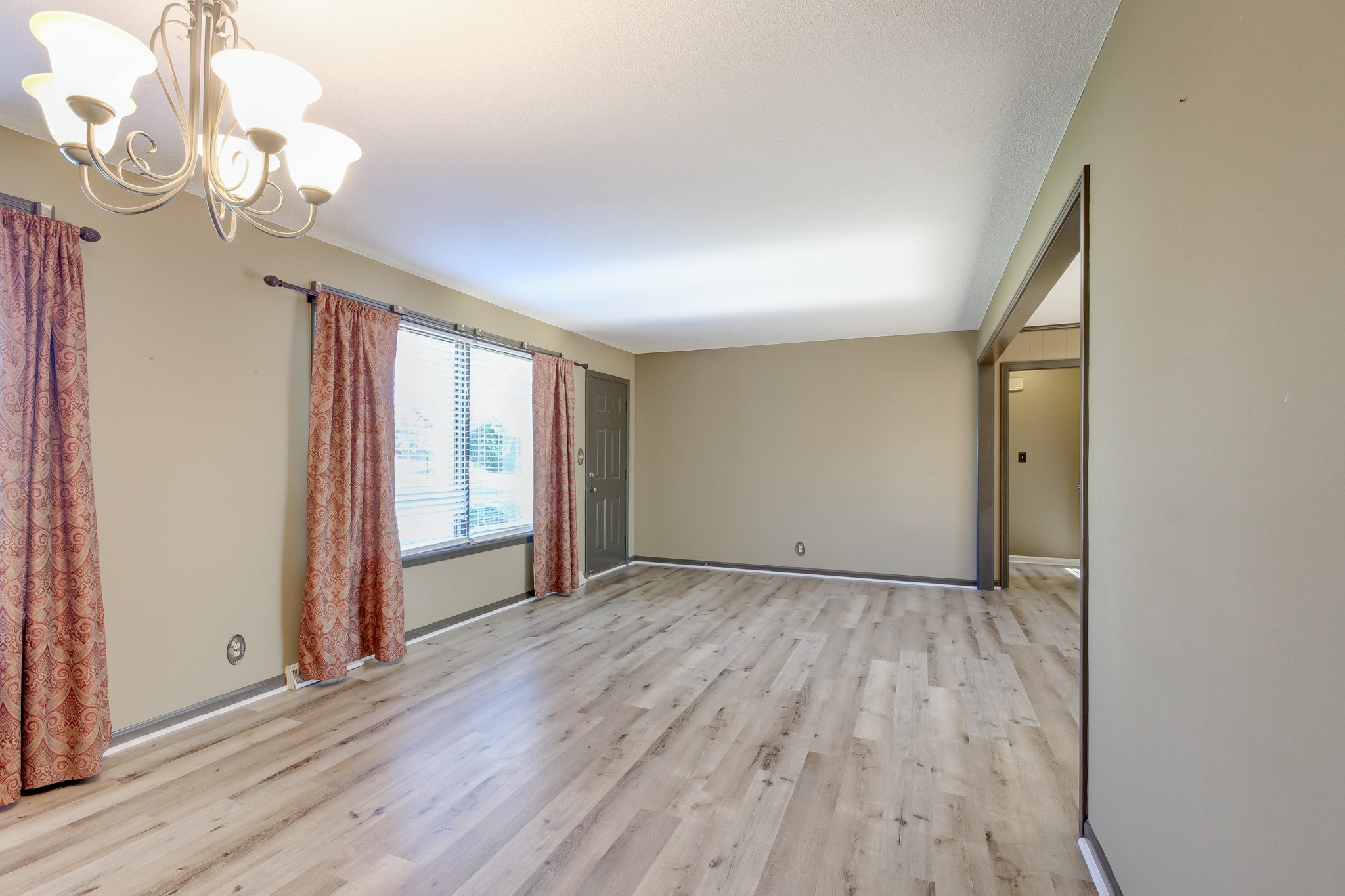 356 Kimbrough Road Clarksville, TN 37043 - Photo 11 of 50 a view of an empty room with wooden floor and a window