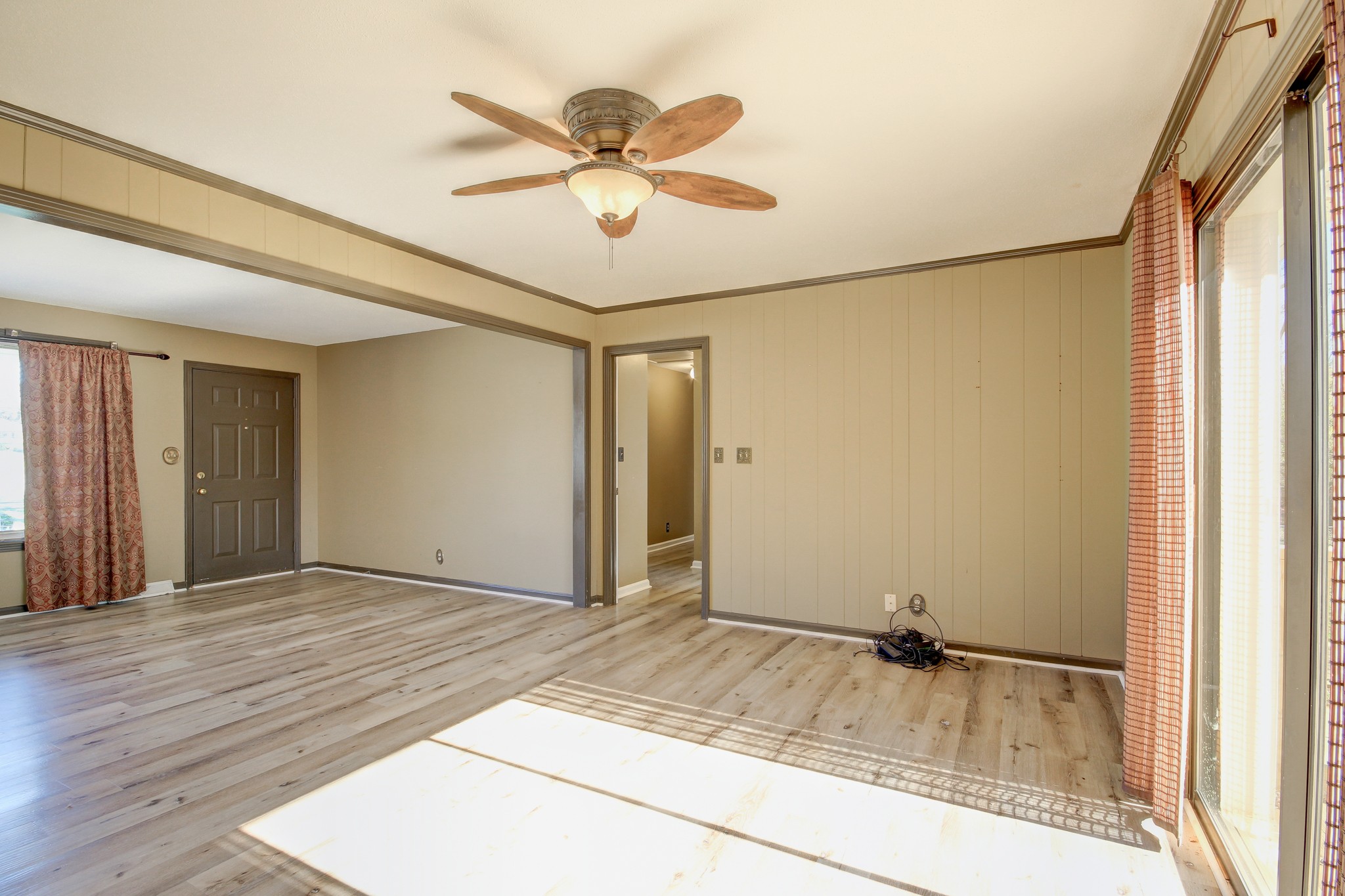 356 Kimbrough Road Clarksville, TN 37043 - Photo 19 of 50 a view of a livingroom with a ceiling fan and wooden floor