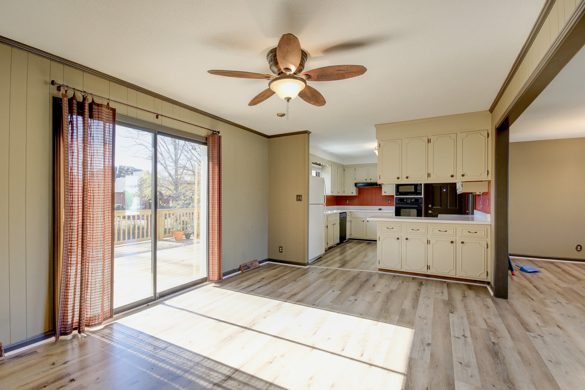 356 Kimbrough Road Clarksville, TN 37043 - Photo 20 of 50 a kitchen with stainless steel appliances kitchen island granite countertop a refrigerator a sink and white cabinets with wooden floor