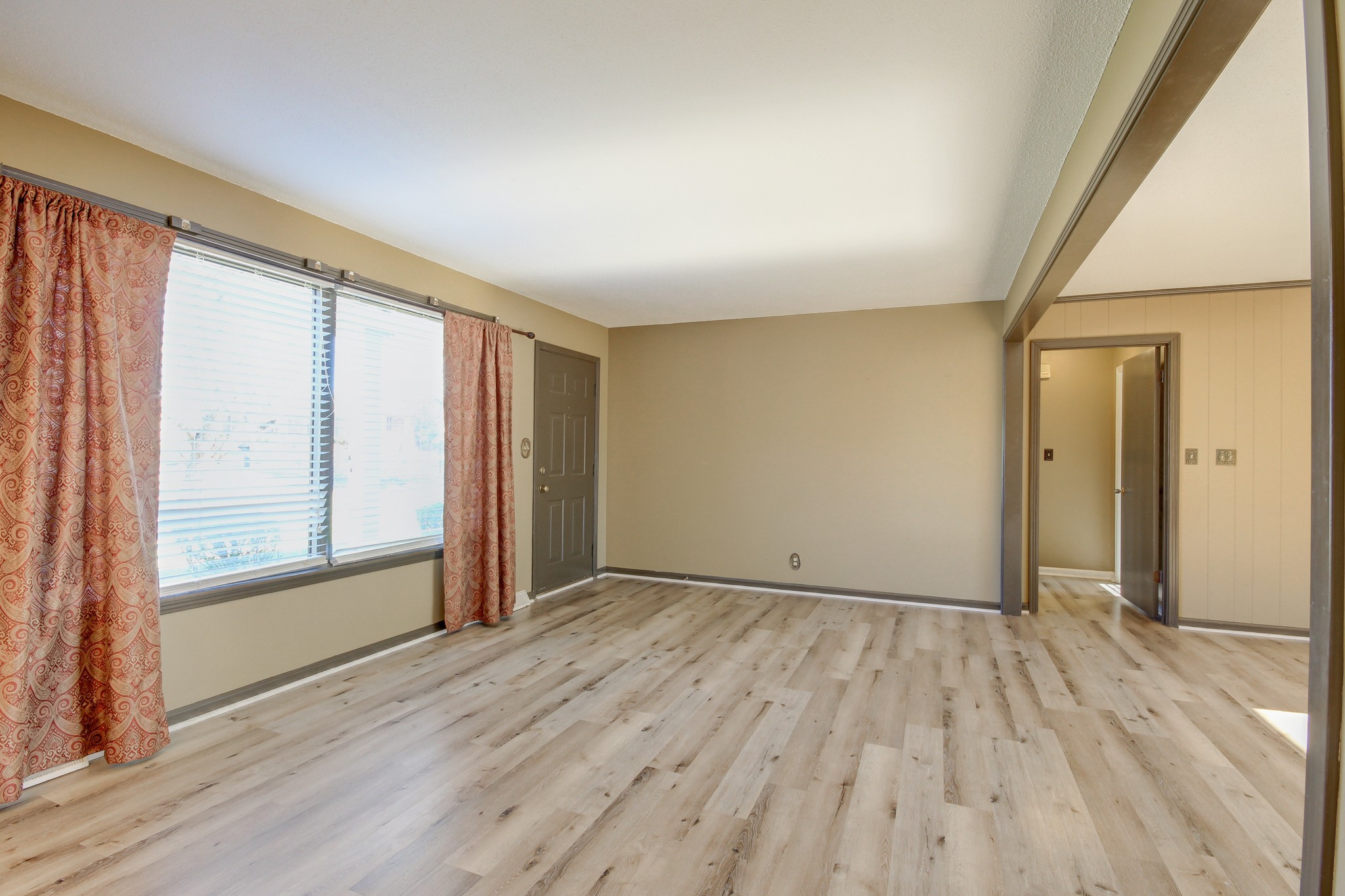 356 Kimbrough Road Clarksville, TN 37043 - Photo 6 of 50 an empty room with wooden floor and windows