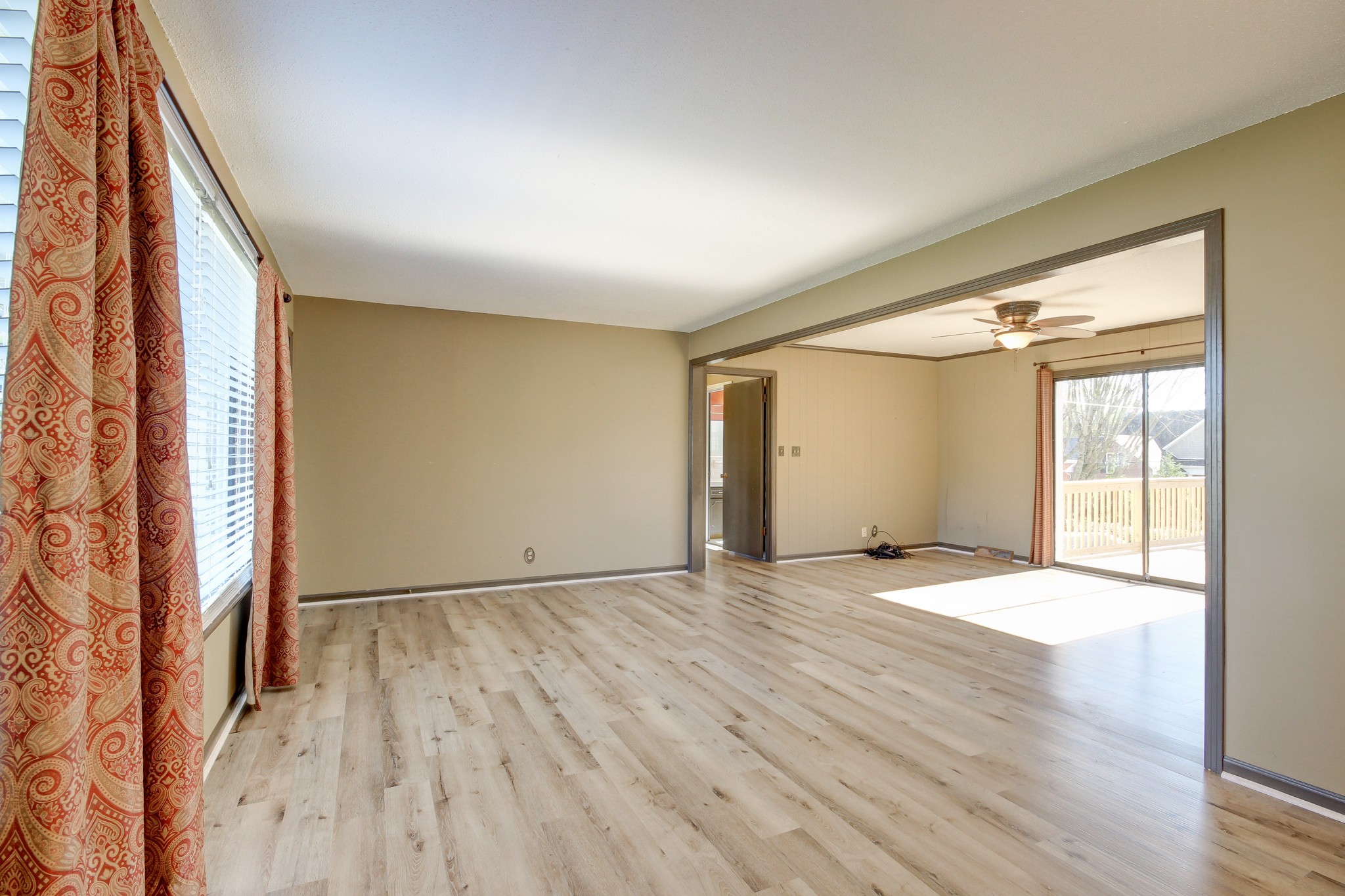 356 Kimbrough Road Clarksville, TN 37043 - Photo 7 of 50 an empty room with wooden floor and windows