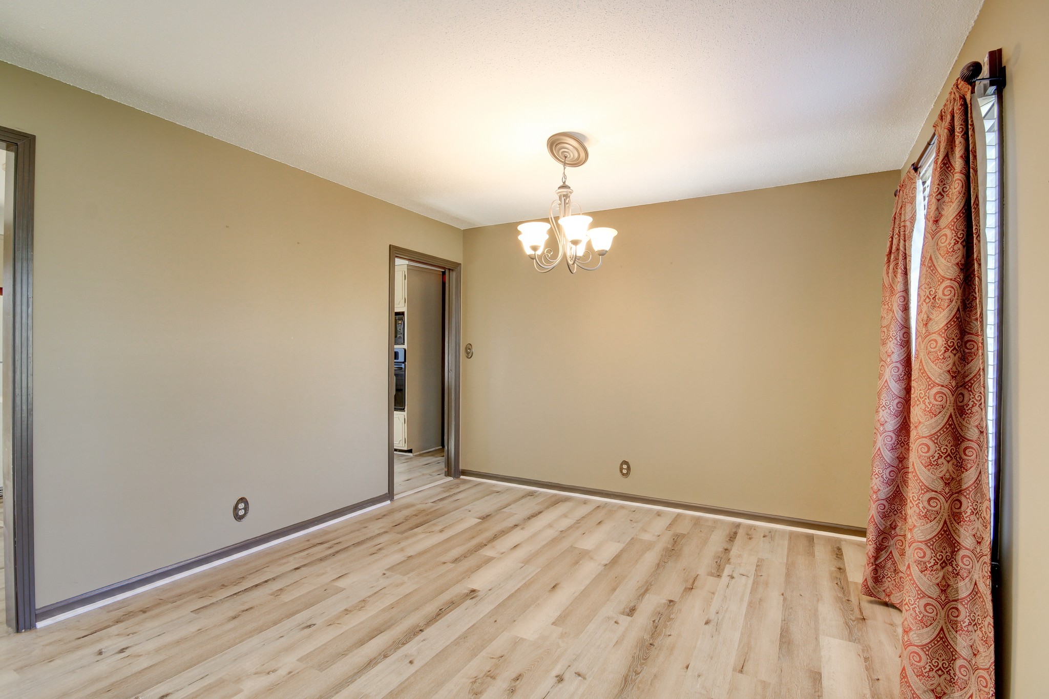 356 Kimbrough Road Clarksville, TN 37043 - Photo 9 of 50 wooden floor in an empty room with a window