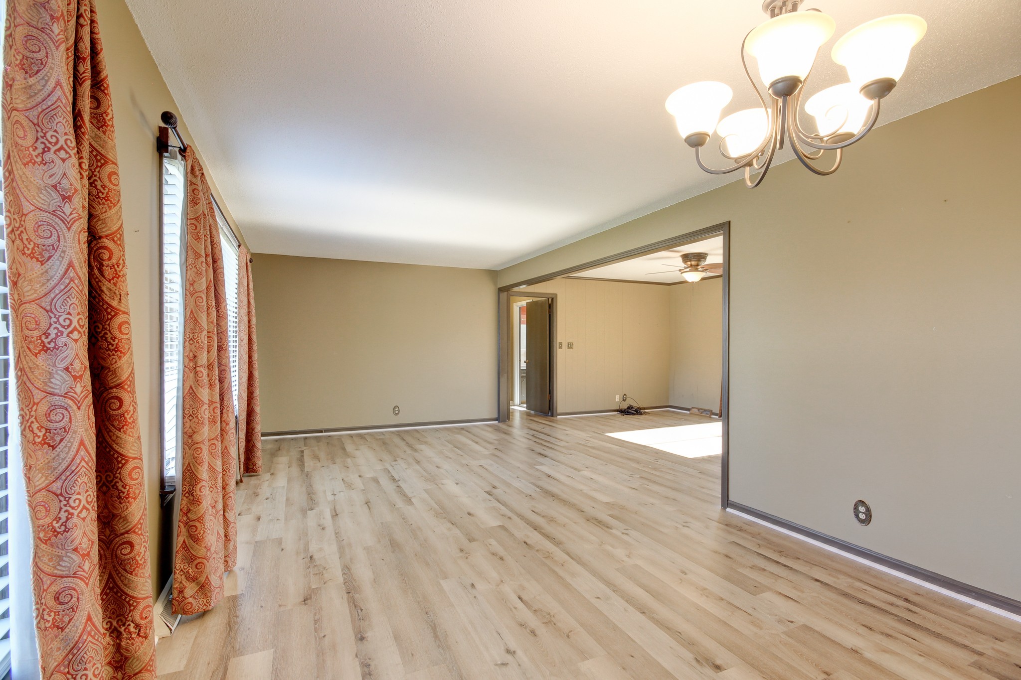 356 Kimbrough Road Clarksville, TN 37043 - Photo 10 of 50 a view of an empty room with wooden floor and a window