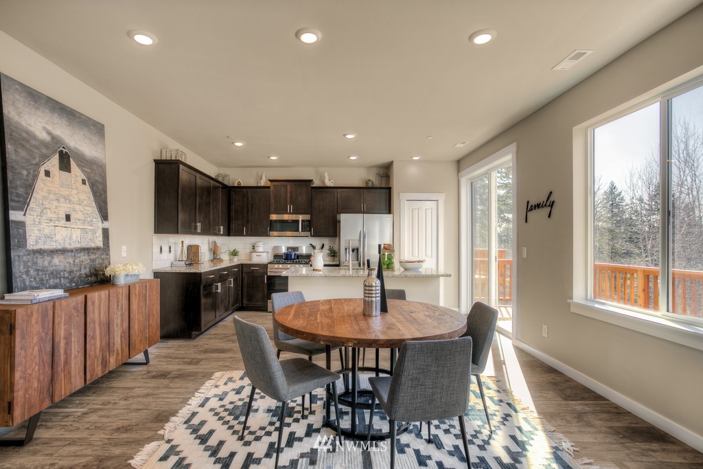 13 180th Place Southeast, Unit 40 Bothell, WA 98012 - Photo 15 of 40 a kitchen with a table and chairs in it