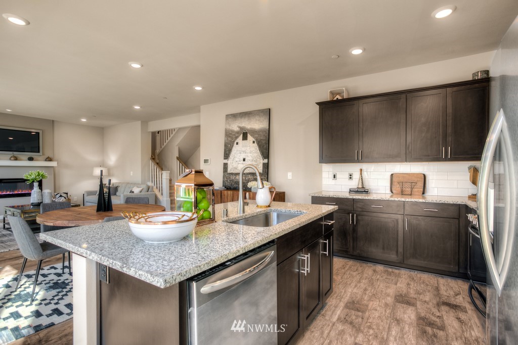 13 180th Place Southeast, Unit 40 Bothell, WA 98012 - Photo 22 of 40 a kitchen with granite countertop lots of counter top space and living room