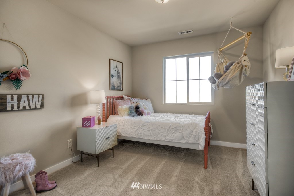 13 180th Place Southeast, Unit 40 Bothell, WA 98012 - Photo 28 of 40 a bedroom with a bed and a window