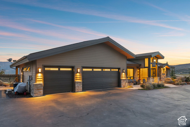 1130 Pace Road Park City, UT 84098 - Photo 72 of 73 Modern exterior with multi-toned siding, stone accents, and a large multi-car garage