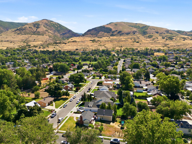 310 East 600 South Centerville, UT 84014 - Photo 41 of 41 Expansive residential area featuring established homes, mature trees, and mountainous terrain