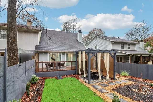 a view of house with yard and entertaining space