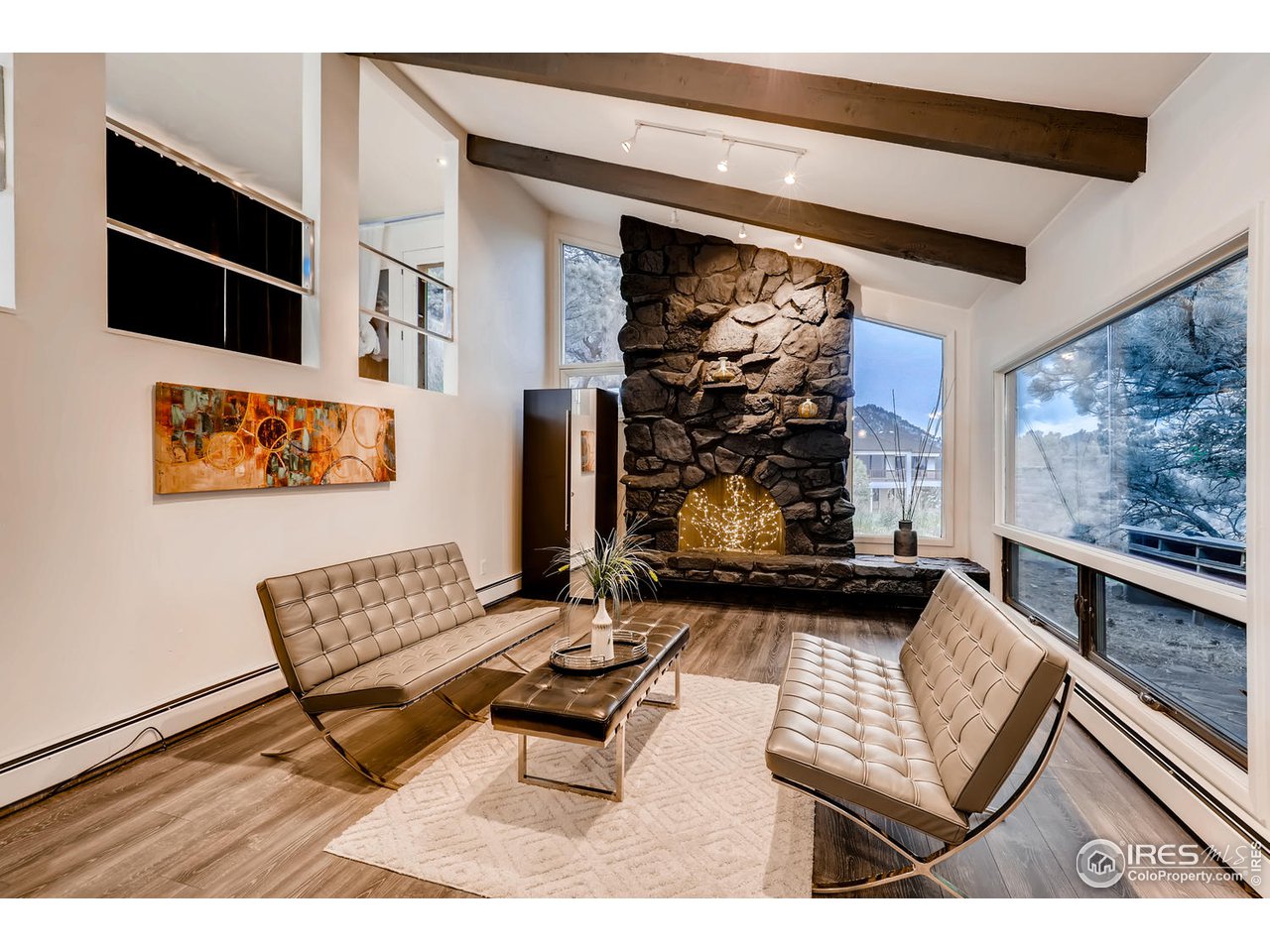 57 Acorn Lane Boulder, CO 80304 - Photo 11 of 40 a living room with furniture and a flat screen tv