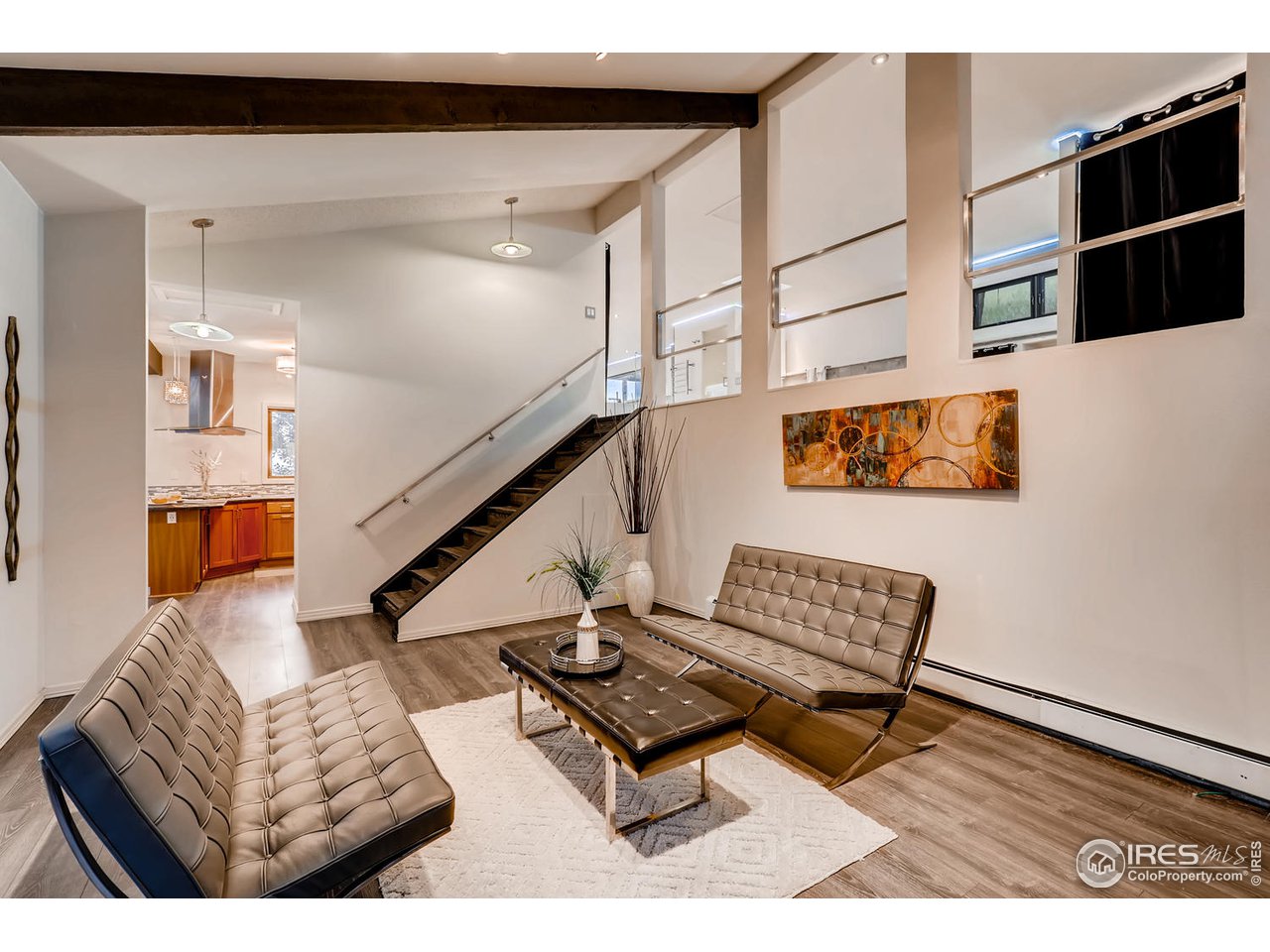 57 Acorn Lane Boulder, CO 80304 - Photo 12 of 40 a living room with furniture and a book shelf