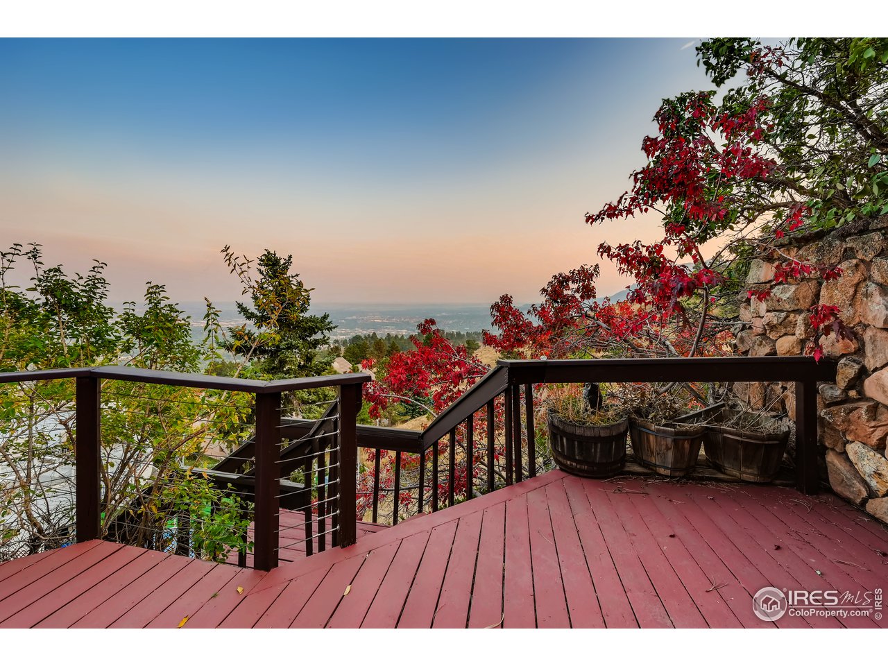 57 Acorn Lane Boulder, CO 80304 - Photo 19 of 40 a view of a balcony with wooden floor and outdoor seating