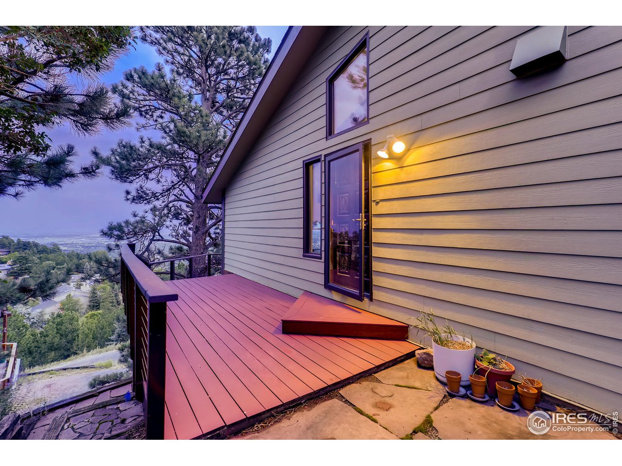 57 Acorn Lane Boulder, CO 80304 - Photo 20 of 40 a backyard of a house with wooden floor