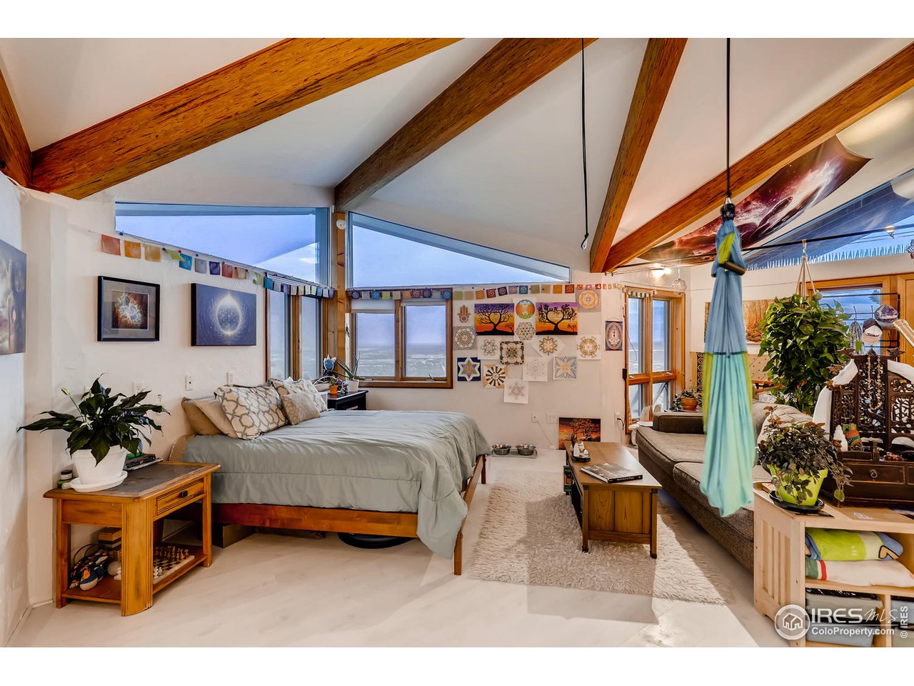 57 Acorn Lane Boulder, CO 80304 - Photo 23 of 40 a outdoor space with the couches and dining table view