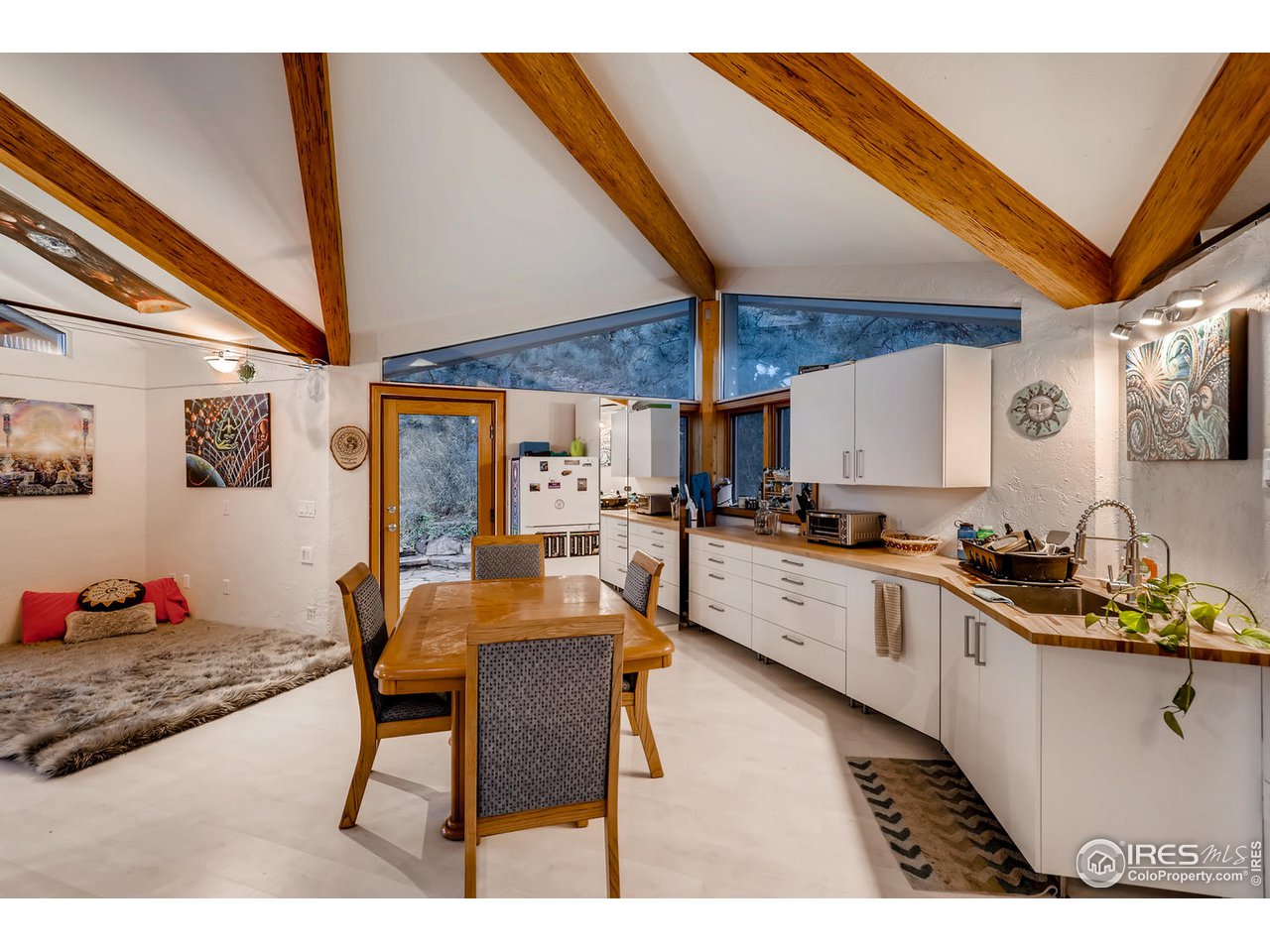 57 Acorn Lane Boulder, CO 80304 - Photo 24 of 40 a kitchen with stainless steel appliances kitchen island granite countertop a sink and cabinets