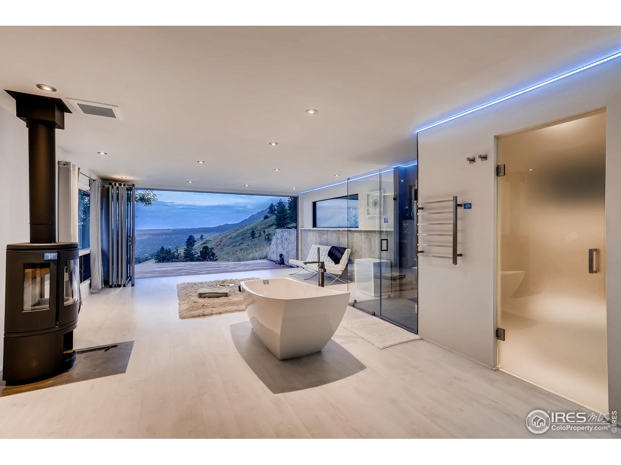 57 Acorn Lane Boulder, CO 80304 - Photo 3 of 40 a living room with stainless steel appliances kitchen island granite countertop a refrigerator a stove and a sink with wooden cabinets