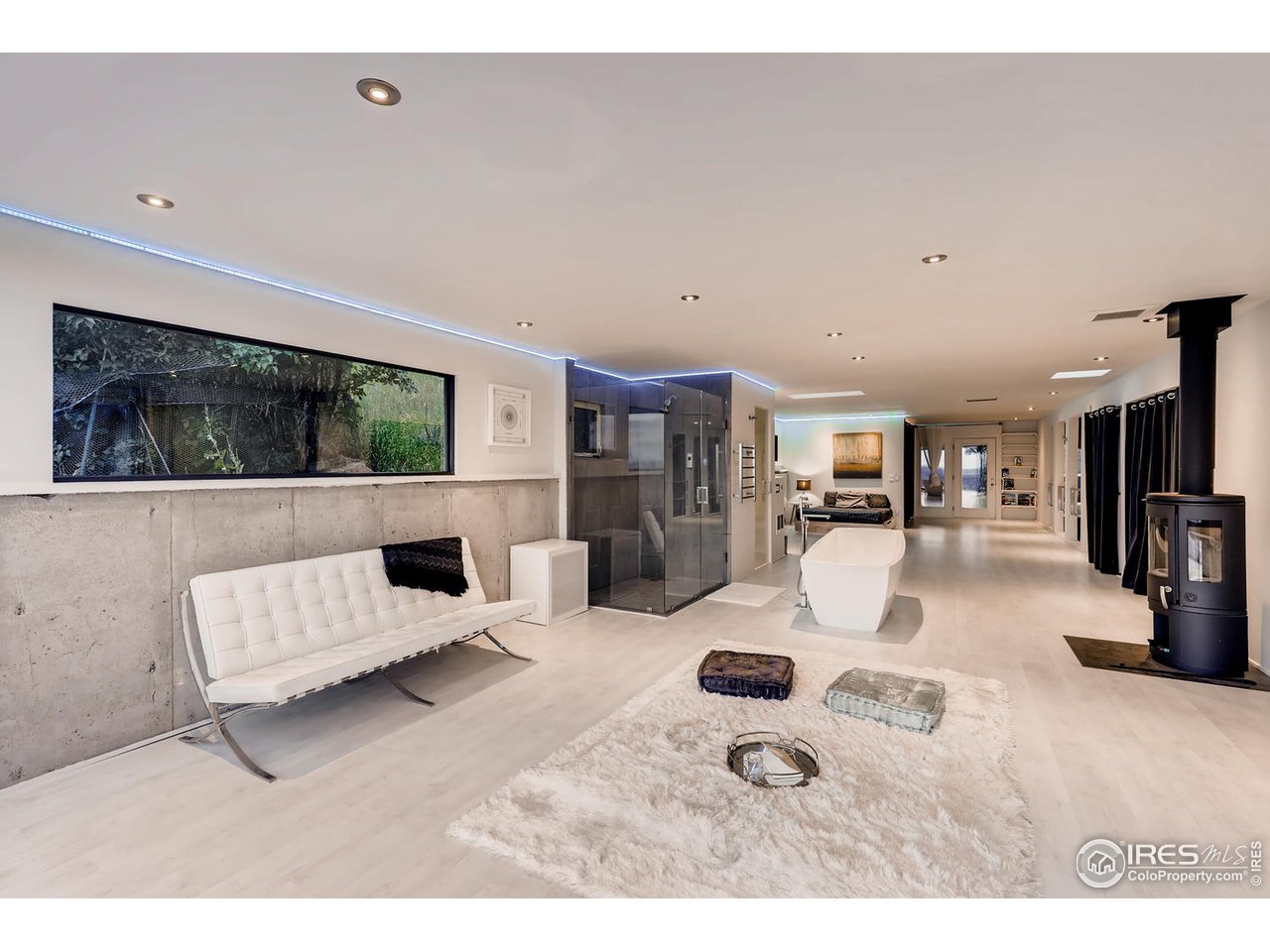 57 Acorn Lane Boulder, CO 80304 - Photo 4 of 40 a living room with furniture and a flat screen tv