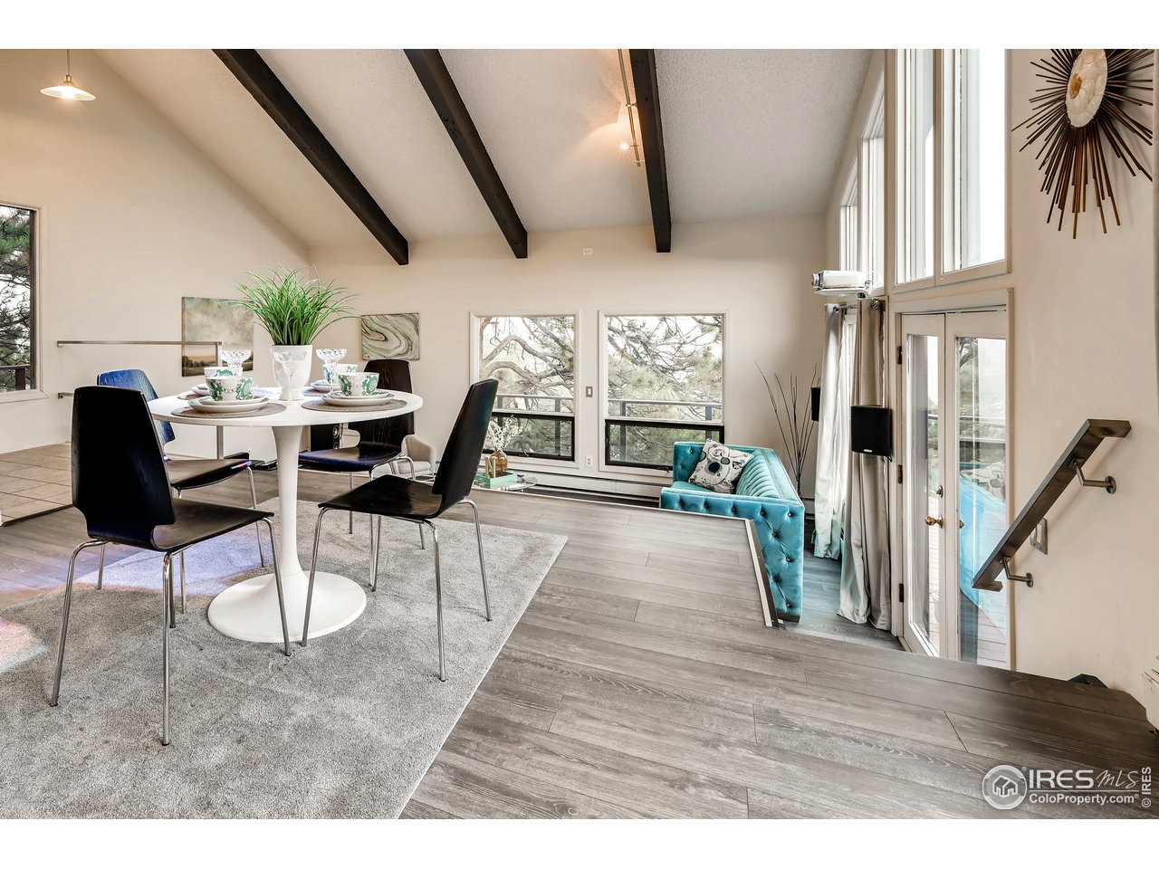 57 Acorn Lane Boulder, CO 80304 - Photo 10 of 40 a living room with furniture or wooden floor and a large window
