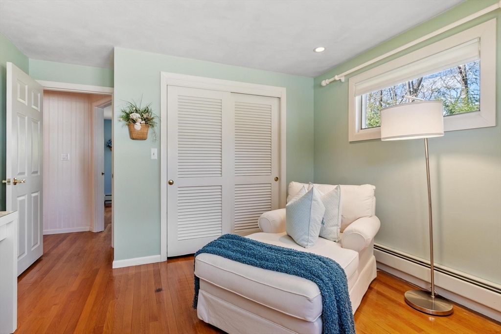 18 Howe Avenue Shrewsbury, MA 01545 - Photo 18 of 42 a bedroom with a bed and wooden floor