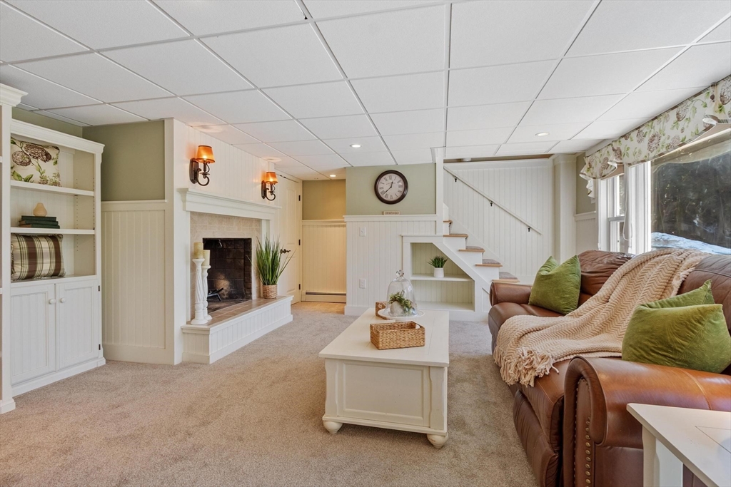 18 Howe Avenue Shrewsbury, MA 01545 - Photo 23 of 42 a living room with furniture and a fireplace
