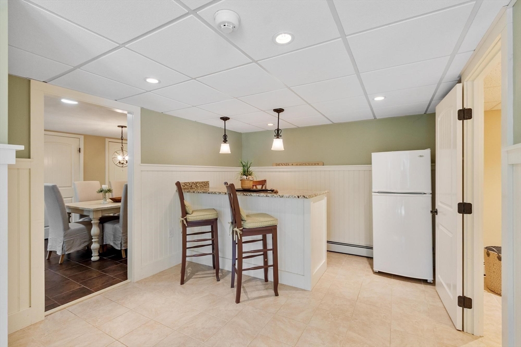 18 Howe Avenue Shrewsbury, MA 01545 - Photo 26 of 42 a view of kitchen with furniture and a refrigerator