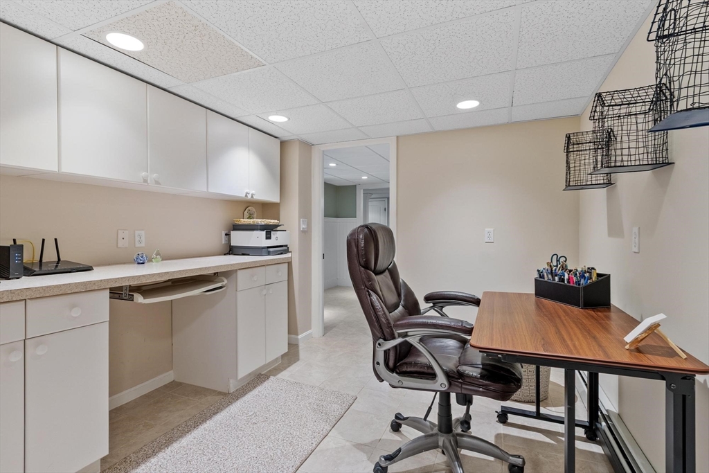 18 Howe Avenue Shrewsbury, MA 01545 - Photo 29 of 42 a kitchen that has a sink and chair in it