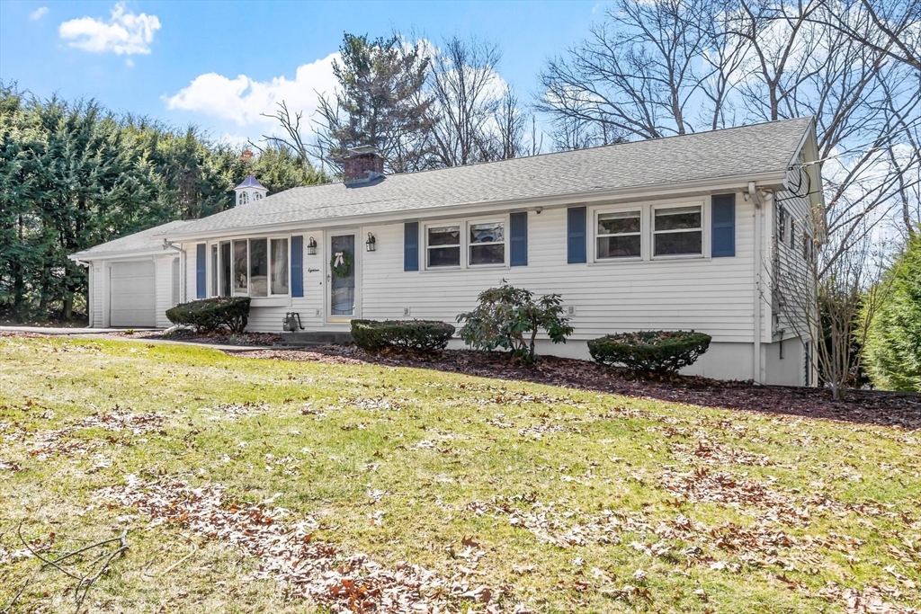 18 Howe Avenue Shrewsbury, MA 01545 - Photo 3 of 42 a front view of a house with a yard table and chairs