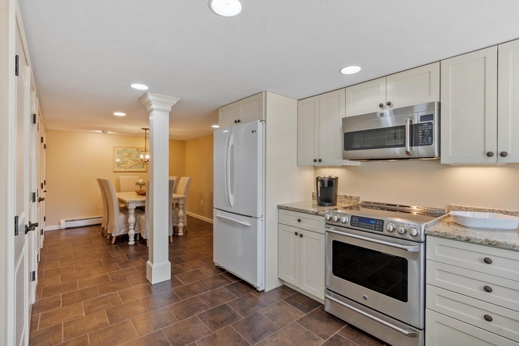 18 Howe Avenue Shrewsbury, MA 01545 - Photo 34 of 42 a kitchen with a stove a refrigerator and a sink