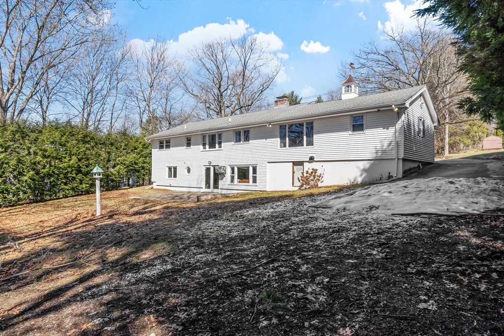 18 Howe Avenue Shrewsbury, MA 01545 - Photo 38 of 42 a house with trees in front of it