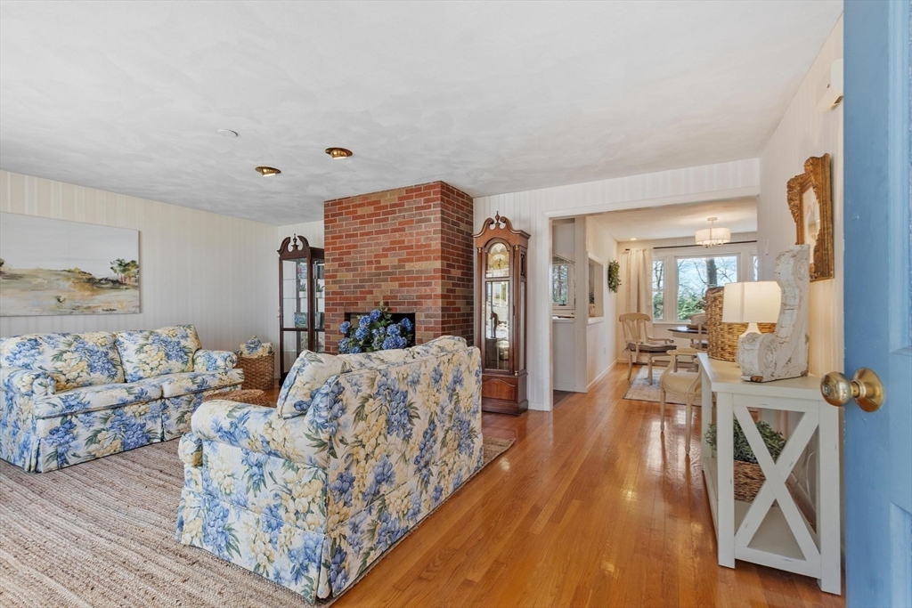 18 Howe Avenue Shrewsbury, MA 01545 - Photo 4 of 42 a living room with furniture a couch and a chandelier