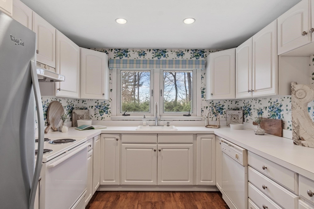 18 Howe Avenue Shrewsbury, MA 01545 - Photo 9 of 42 a kitchen with white cabinets and white appliances