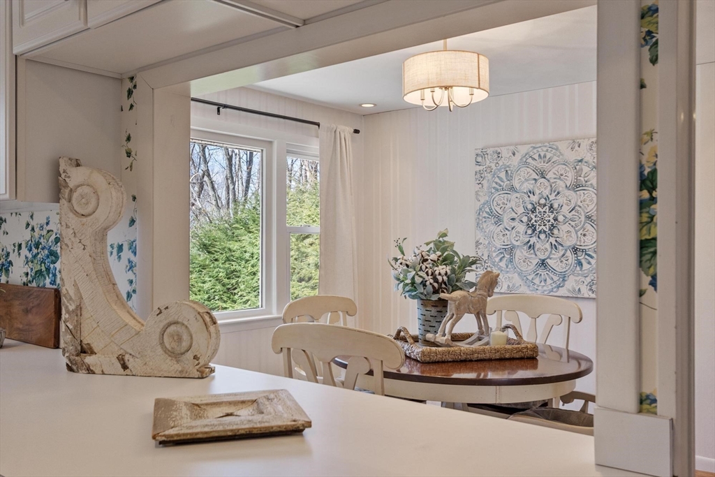 18 Howe Avenue Shrewsbury, MA 01545 - Photo 10 of 42 a view of a lobby with chair and flower vase